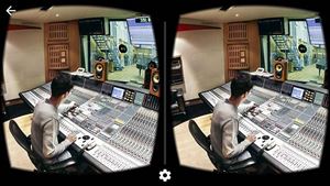 Virtual view of Abbey Road music studios, showing engineer at a mixing desk
